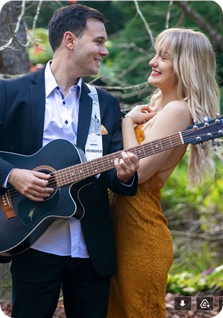 young couple enjoying music and playing guitar.